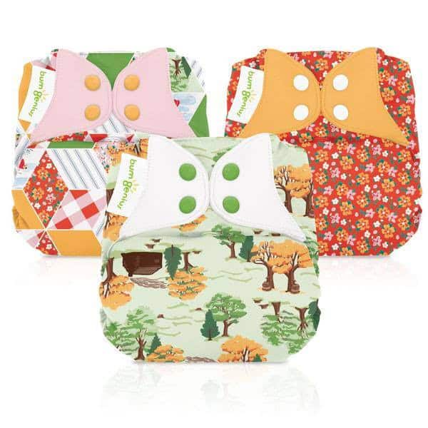 Set of three floral Bumgenius reusable nappies.