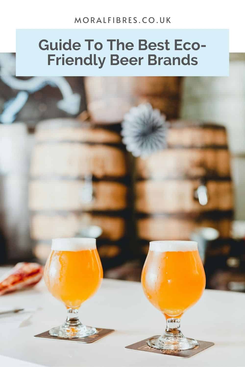 Two glasses of beer on a white counter, with beer barrels out of focus. A blue text box reads guide to the best eco-friendly beer brands.